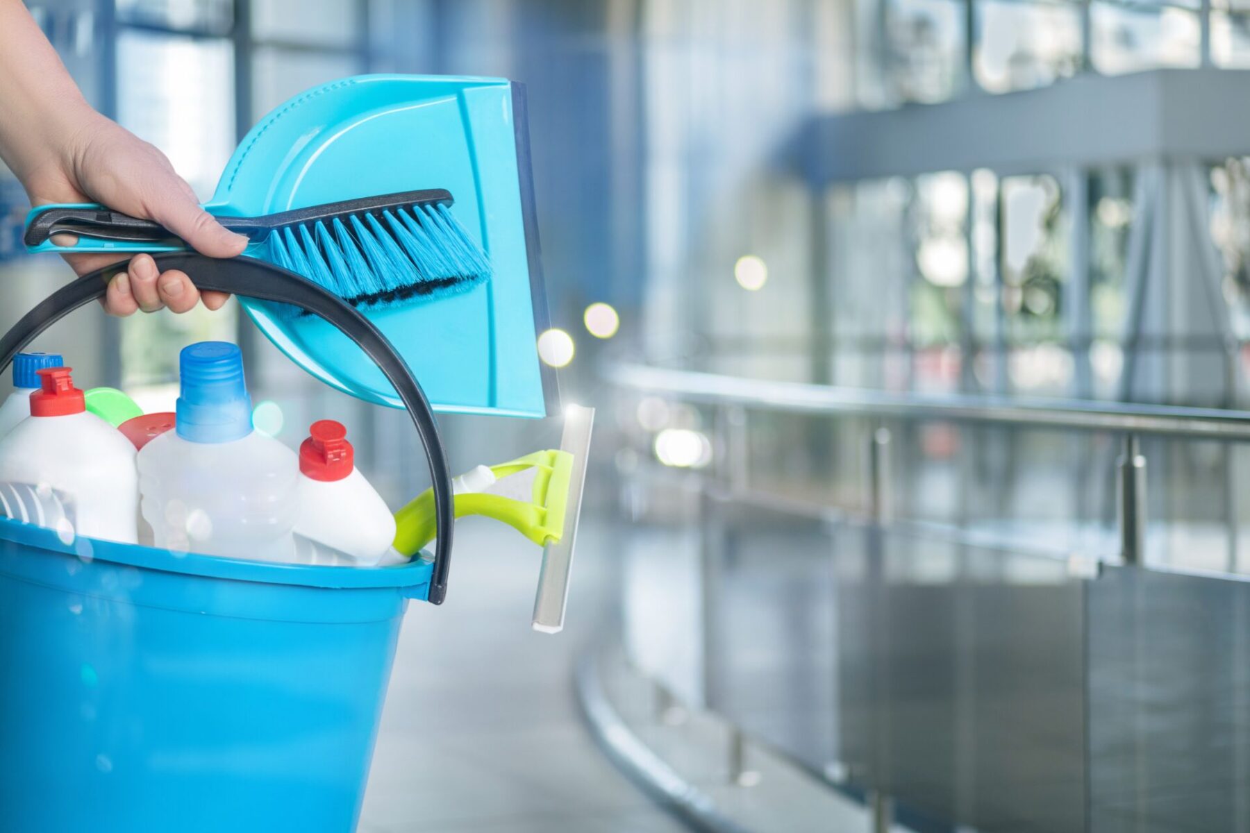 Cleaning,Lady,With,Cleaning,Products,On,A,Blurred,Background.,Cleaning